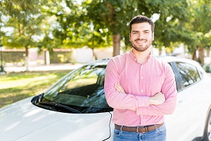 a person standing next to a car